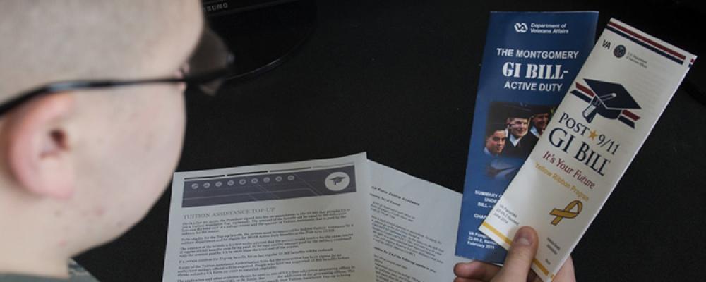 Guardsman with GI Bill Brochures Thumbnail