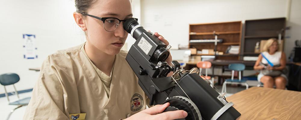 Air_Doctor looking into microscope Thumbnail
