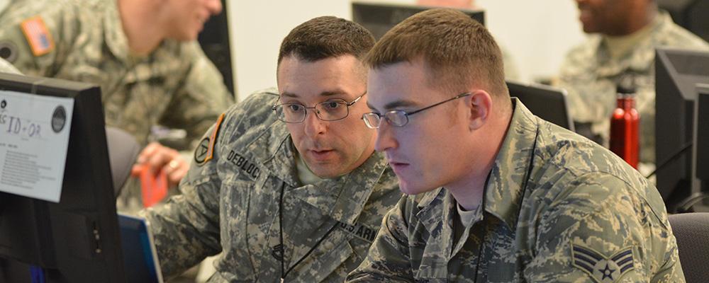 Guardsmen on computer